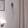 Particolare Applique sferetta vetro bianca 1 luce design curva 90 nero ottone