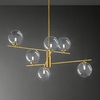 Particolare di Lampadario 6 bolle di luce sospese in ottone brunito con sfere in vetro trasparente  