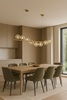 Altra ambientazione di Lampadario sfere di vetro barra oro satinato avvolto da 8 sfere  41874
