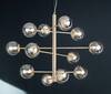 Lampadario design radiale oro sfere ambra 12 luci E14 grandi living  44825